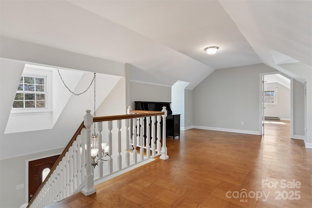 additional living space with vaulted ceiling