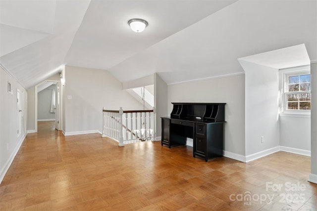 bonus room featuring light parquet floors and lofted ceiling