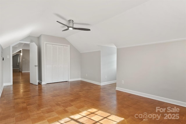 additional living space with ceiling fan and vaulted ceiling