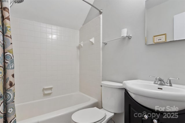 full bathroom featuring lofted ceiling, vanity, toilet, and shower / bathtub combination with curtain