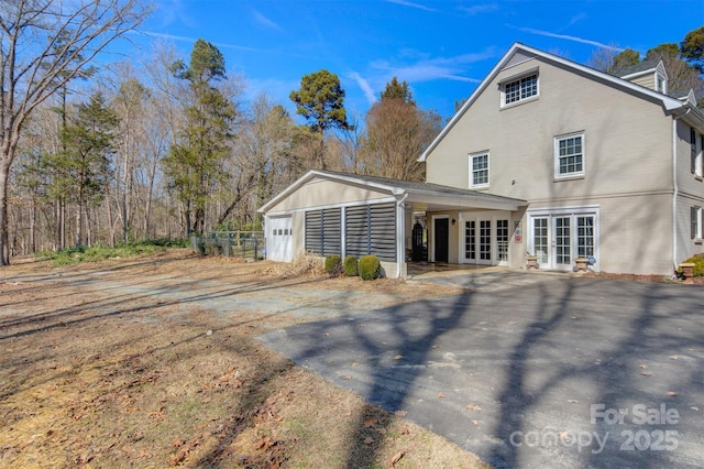 view of property exterior featuring french doors