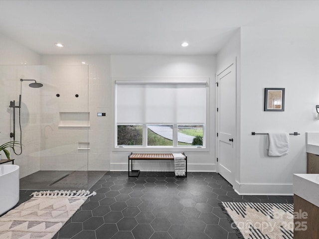 bathroom with vanity, tile patterned floors, and shower with separate bathtub