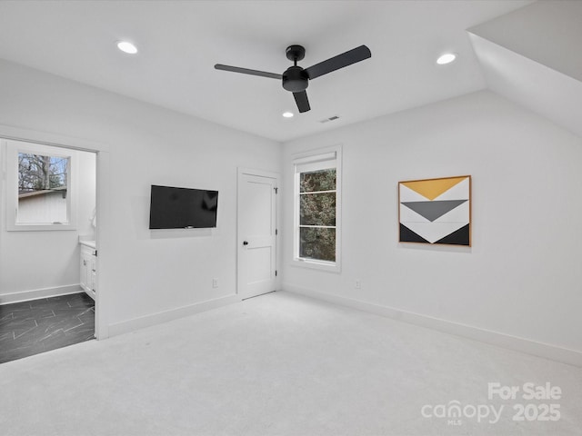 unfurnished living room featuring lofted ceiling, carpet floors, and ceiling fan