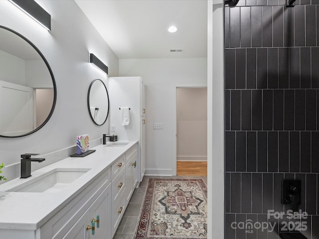 bathroom featuring vanity and tile patterned flooring