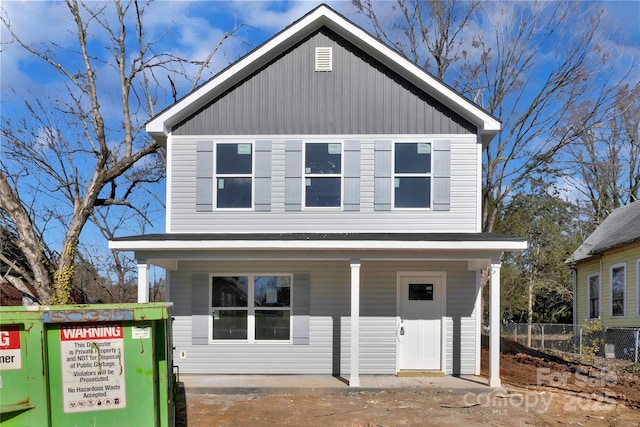 view of front of house featuring cooling unit and fence