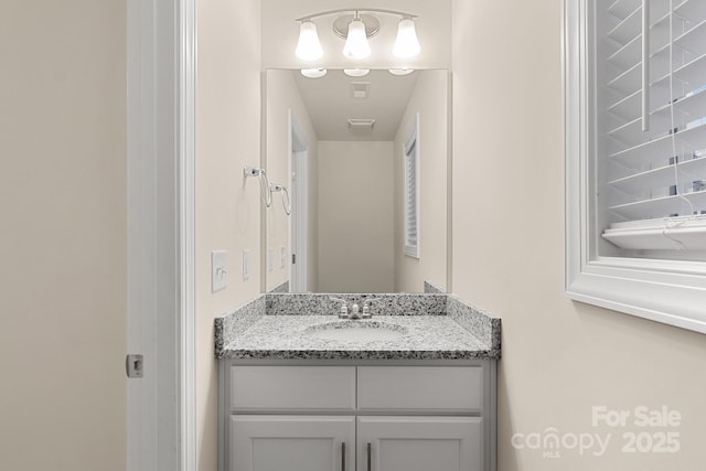 bathroom featuring visible vents and vanity