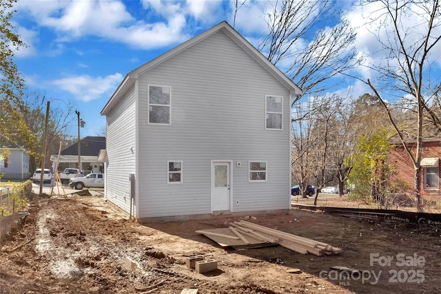 rear view of property with fence