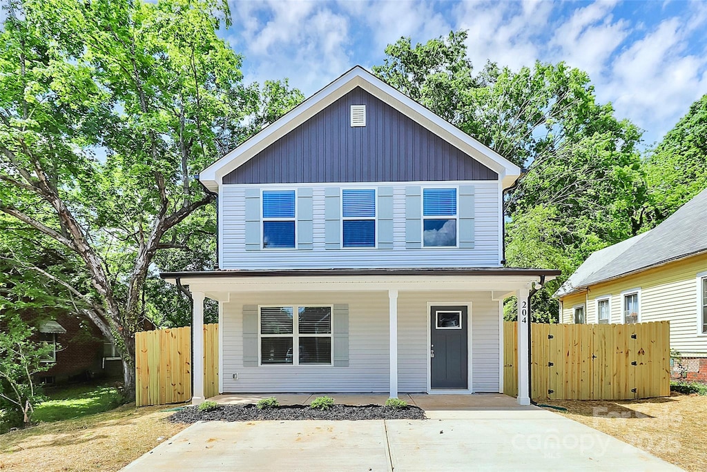 204 N Yadkin Ave, Spencer, NC 28150 - traditional-style home featuring covered porch, fence, and a gate