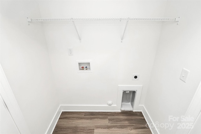 laundry area featuring electric dryer hookup, laundry area, washer hookup, dark wood-style flooring, and baseboards