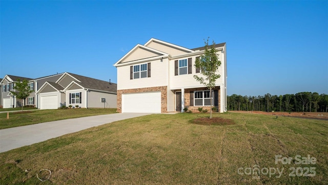 view of front of house featuring a garage and a front lawn