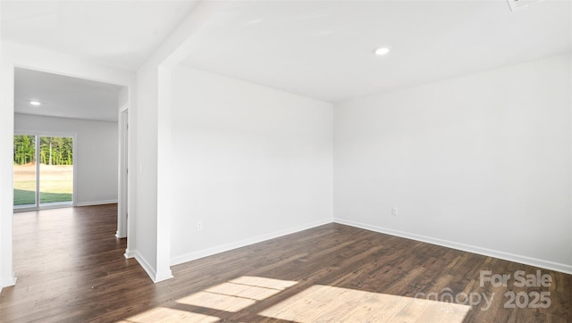 unfurnished room featuring dark hardwood / wood-style floors