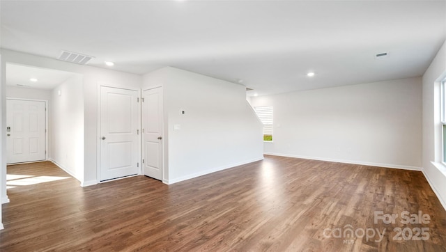 spare room with hardwood / wood-style flooring