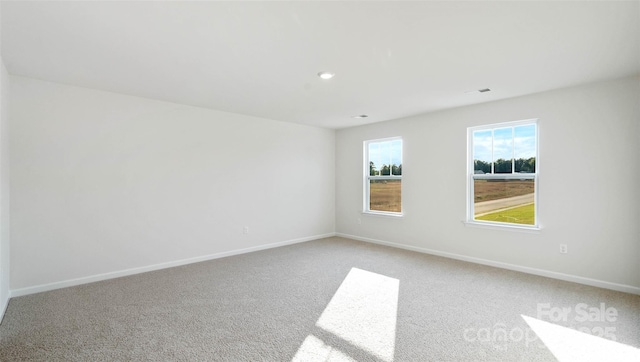 empty room featuring light colored carpet