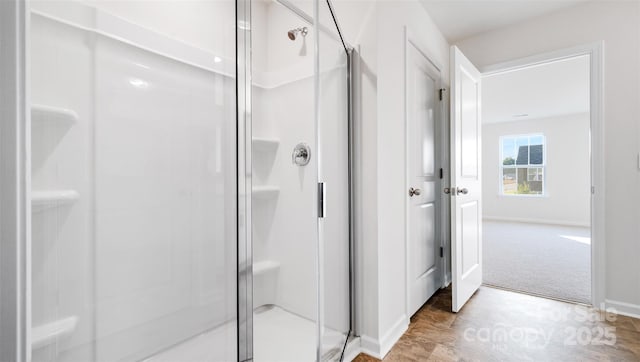 bathroom with a shower with shower door