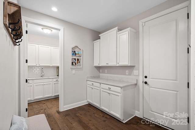 interior space featuring sink and dark hardwood / wood-style floors