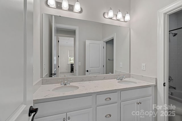 full bathroom featuring vanity, toilet, and tiled shower / bath combo