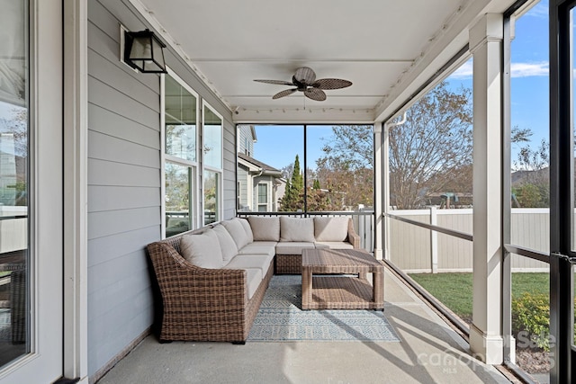 sunroom / solarium featuring ceiling fan