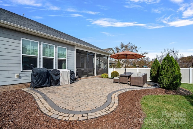 view of patio / terrace with grilling area, an outdoor living space, and a sunroom