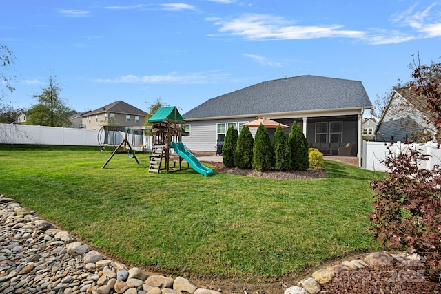 exterior space with a yard and a sunroom