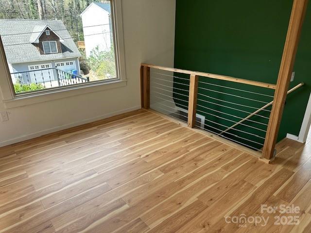 16 Castle St, Asheville, NC 28803 - unfurnished room with baseboards and wood finished floors