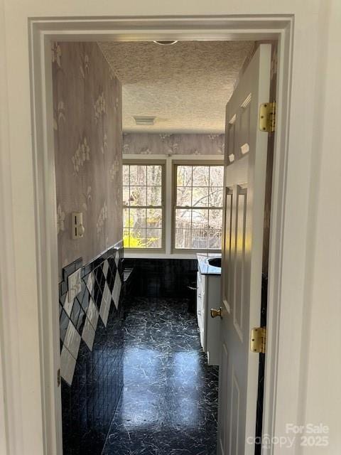 16 Castle St, Asheville, NC 28803 - bathroom featuring vanity and a textured ceiling