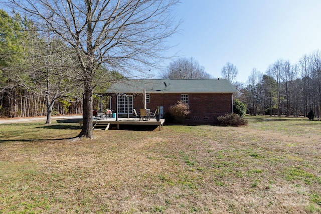 view of yard featuring a wooden deck