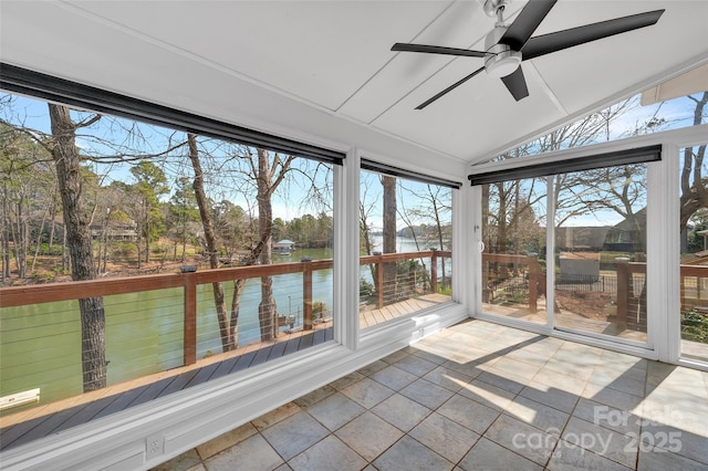 unfurnished sunroom with lofted ceiling and ceiling fan