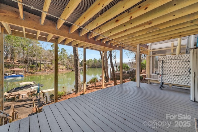 wooden deck featuring a water view and a boat dock