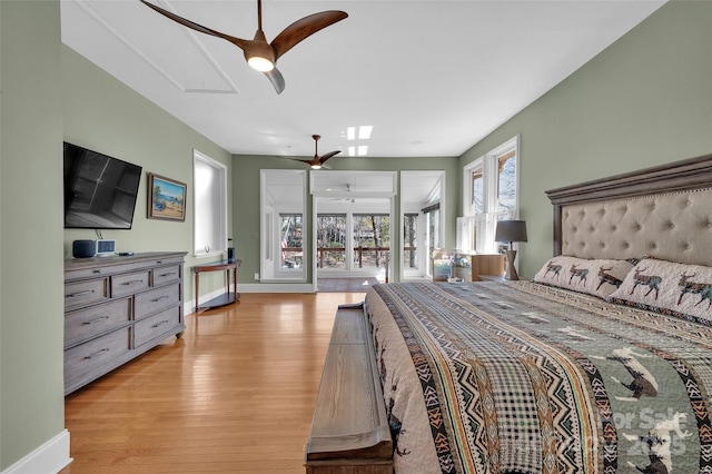 1077 Gauguin Ln, Tega Cay, SC 29708 - bedroom featuring attic access, light wood-style flooring, baseboards, and ceiling fan