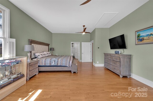 1077 Gauguin Ln, Tega Cay, SC 29708 - bedroom featuring attic access, light wood-style floors, baseboards, and a ceiling fan