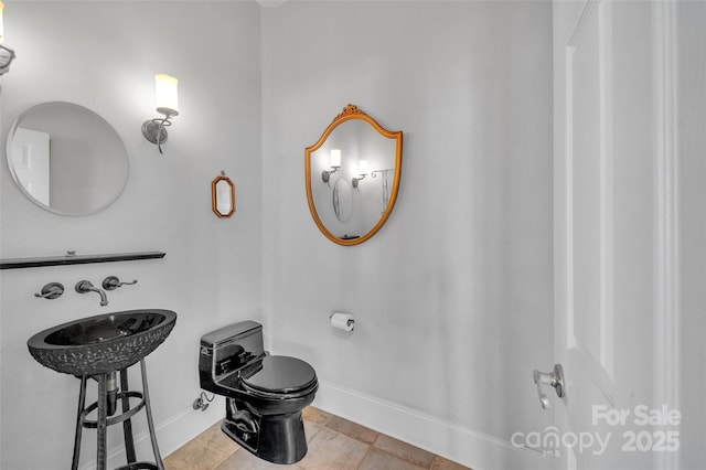 1077 Gauguin Ln, Tega Cay, SC 29708 - half bathroom featuring baseboards and toilet