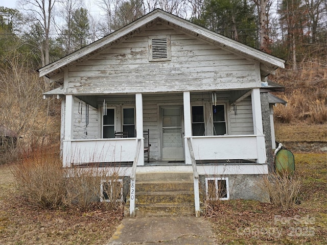 bungalow-style home with a porch