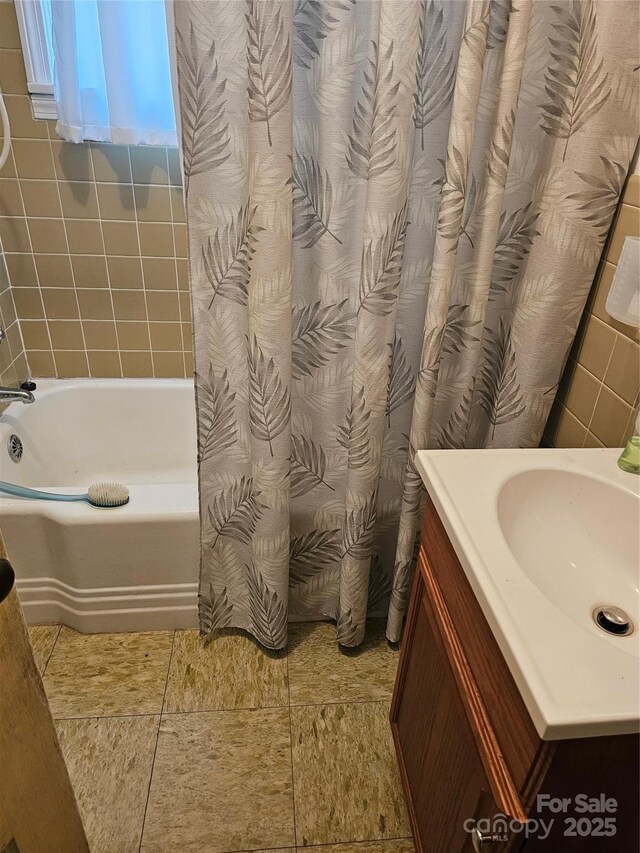 bathroom featuring a bath and vanity