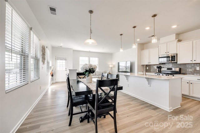 dining room featuring light hardwood / wood-style floors