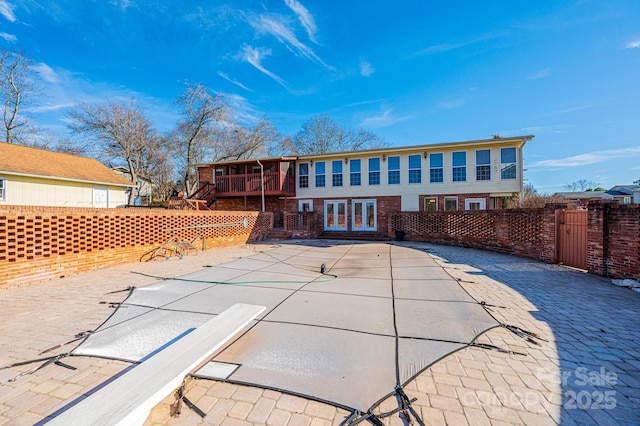 rear view of property with a patio and french doors