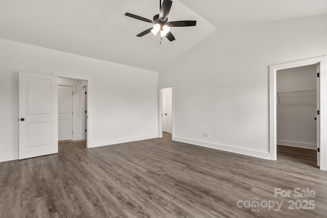 5177 Flay Rd, Lincolnton, NC 28021 - unfurnished bedroom featuring high vaulted ceiling, wood finished floors, a walk in closet, baseboards, and ceiling fan