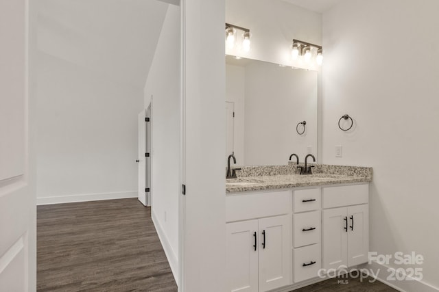 5177 Flay Rd, Lincolnton, NC 28021 - full bathroom featuring double vanity, wood finished floors, and baseboards