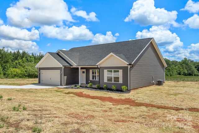 5177 Flay Rd, Lincolnton, NC 28021 - view of front of home featuring central AC unit, concrete driveway, a garage, a front lawn, and a shingled roof