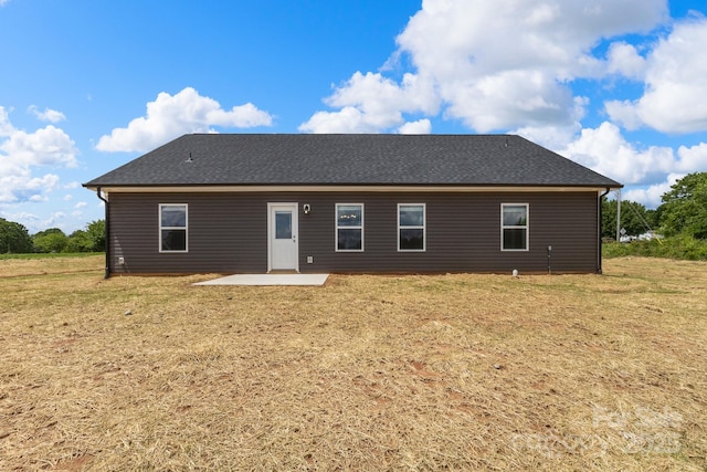 5177 Flay Rd, Lincolnton, NC 28021 - rear view of house with a patio, roof with shingles, and a yard