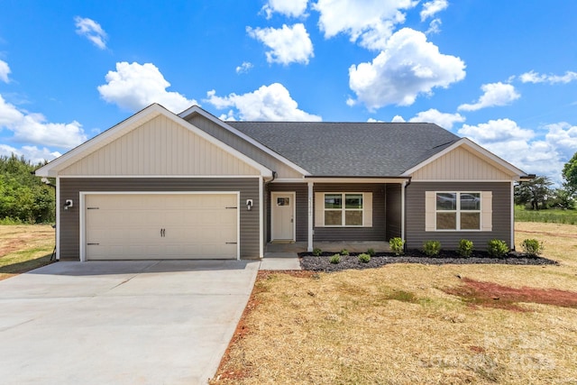 5177 Flay Rd, Lincolnton, NC 28021 - view of front of property featuring an attached garage, roof with shingles, concrete driveway, covered porch, and a front lawn