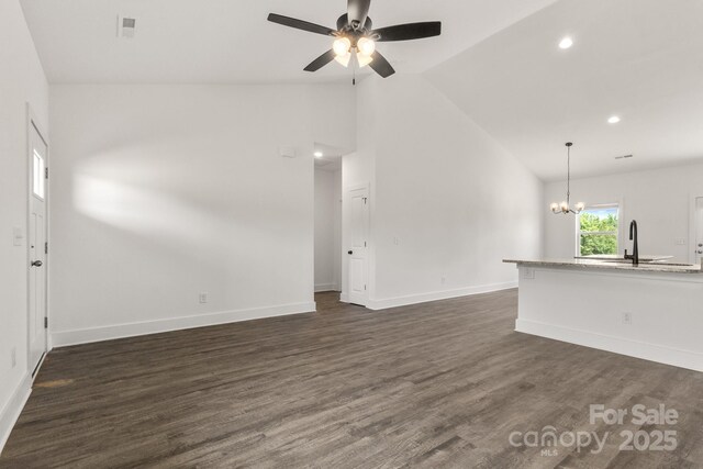5177 Flay Rd, Lincolnton, NC 28021 - unfurnished living room with a ceiling fan, a chandelier, dark wood-type flooring, a sink, and baseboards