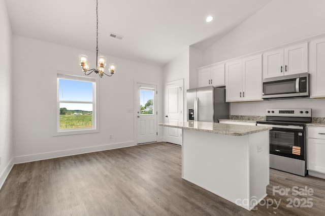 5177 Flay Rd, Lincolnton, NC 28021 - kitchen featuring stainless steel appliances, a chandelier, white cabinetry, wood finished floors, and high vaulted ceiling