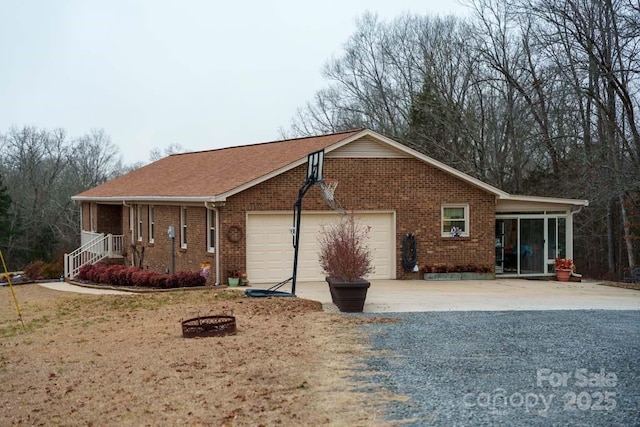 view of property exterior featuring a garage and a sunroom