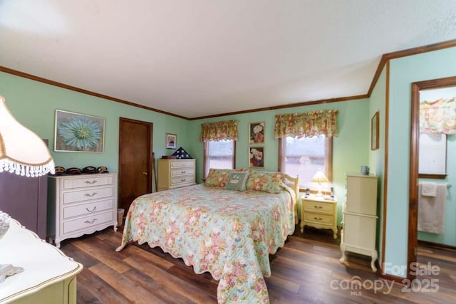 bedroom with dark hardwood / wood-style flooring and crown molding