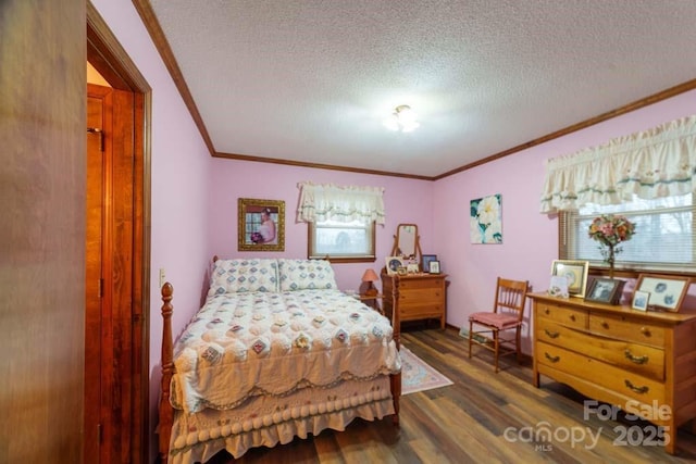 bedroom with crown molding, dark wood-type flooring, and a textured ceiling