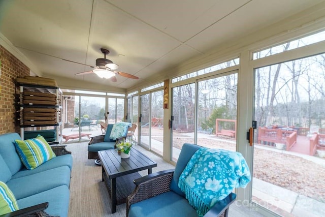 sunroom / solarium with ceiling fan