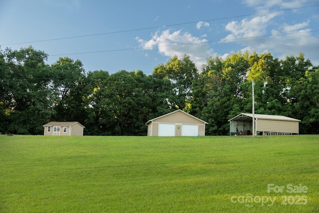 4816 Zion Church Rd, Concord, NC 28025 - view of grassy yard with a detached garage and an outdoor structure