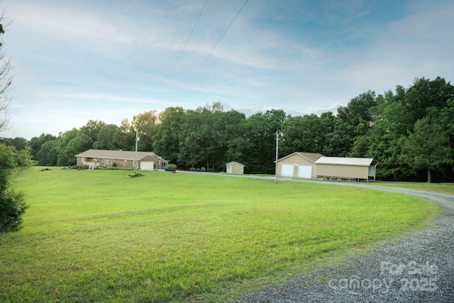 4816 Zion Church Rd, Concord, NC 28025 - view of grassy yard with an outbuilding, a garage, and driveway