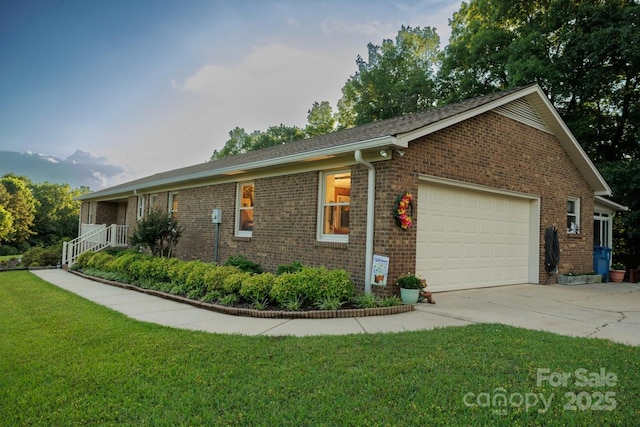 4816 Zion Church Rd, Concord, NC 28025 - view of side of property with an attached garage, driveway, brick siding, and a lawn