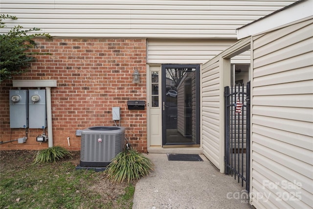 entrance to property featuring central AC unit